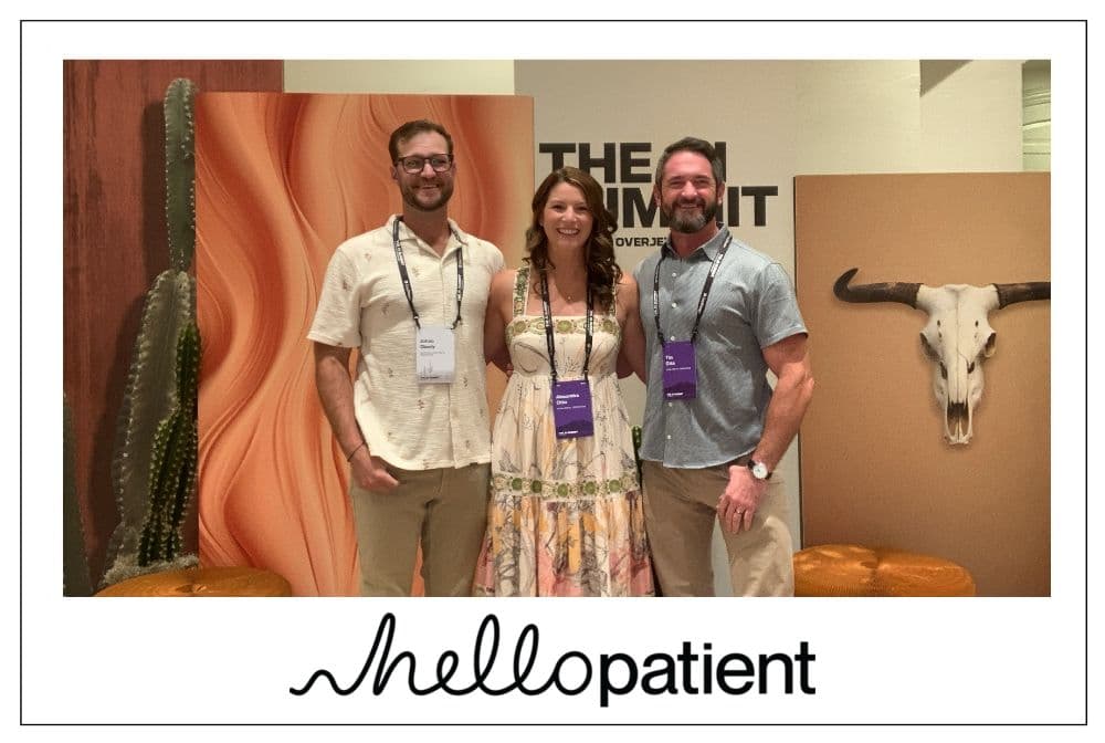 Three attendees posing at the photo booth