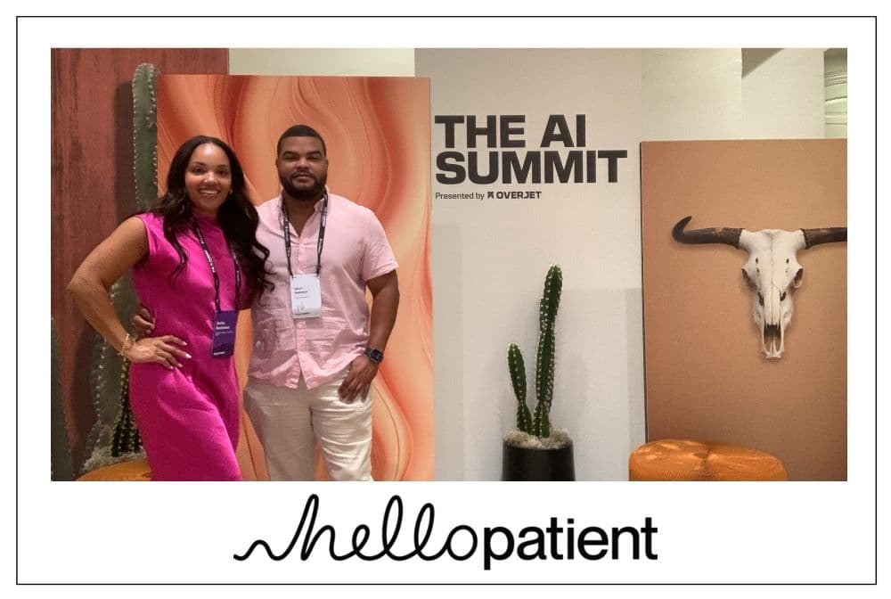 Two attendees posing at the photo booth