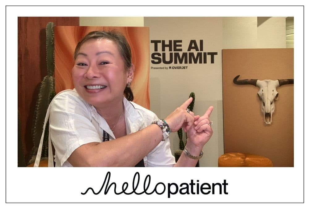 Attendee pointing and smiling at the photo booth