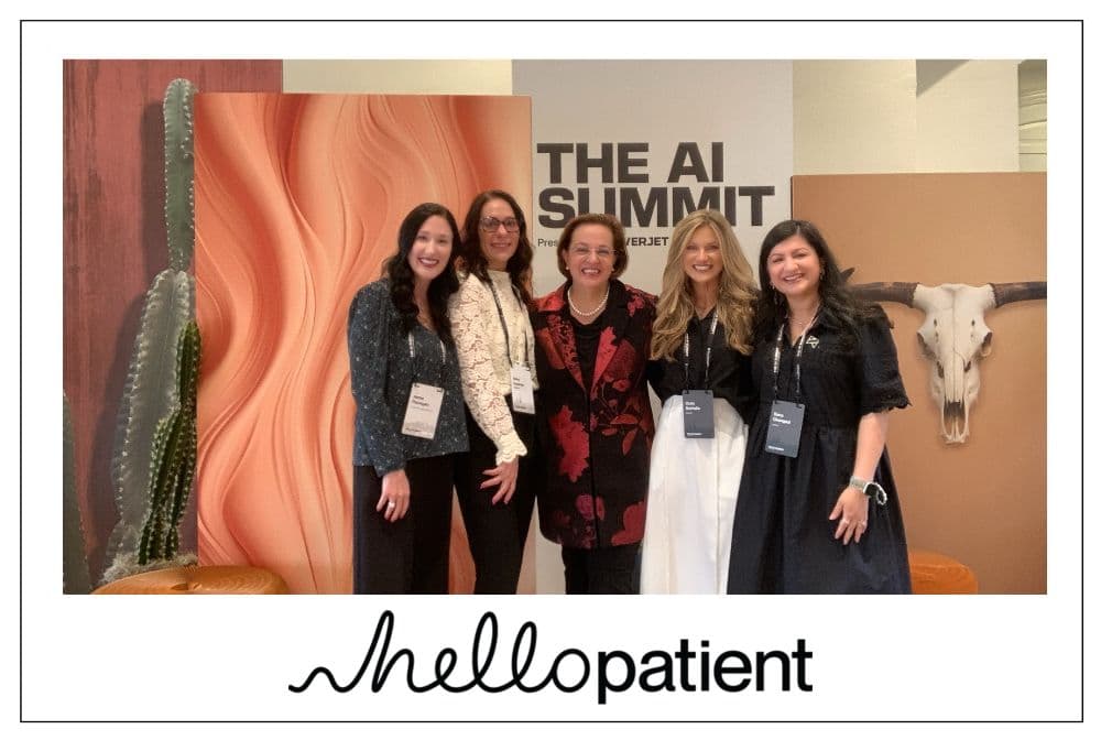 Five attendees posing together at the photo booth