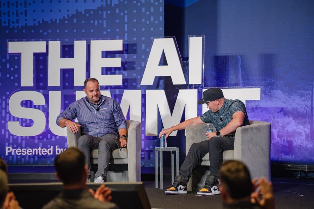 Two speakers in conversation on the main stage