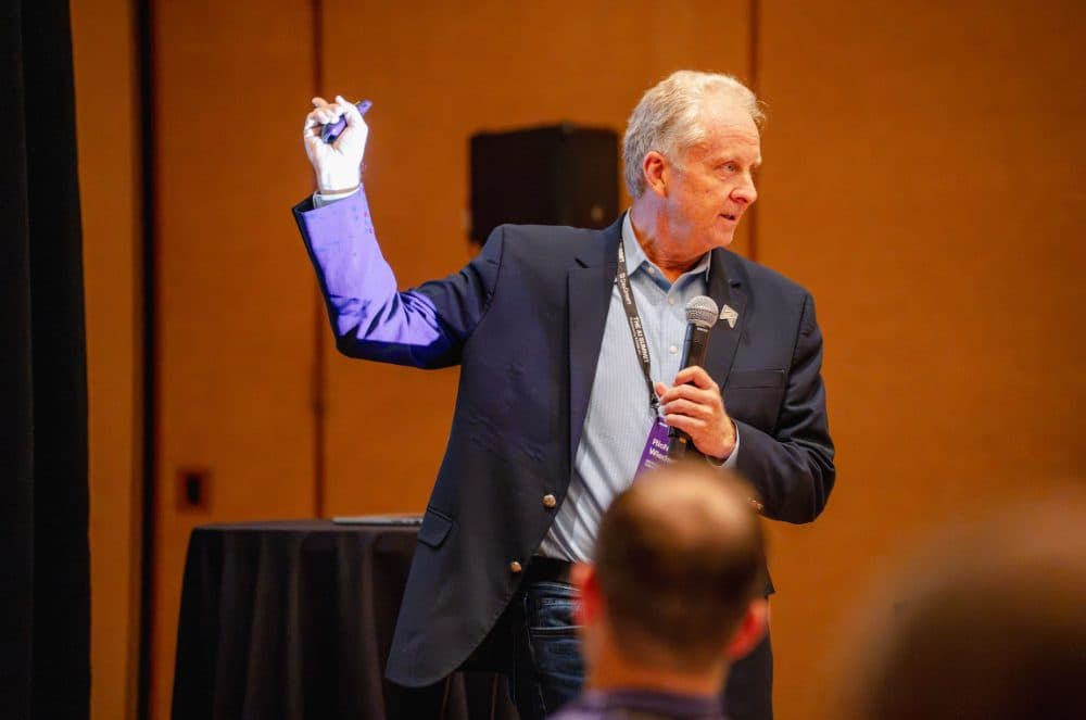 Speaker gesturing with a clicker and microphone