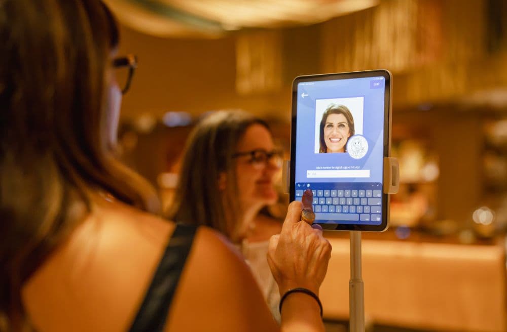 Attendee using a tablet kiosk to get a digital caricature