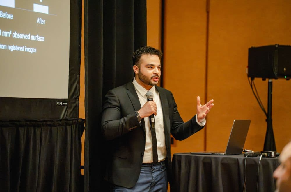 Speaker with a microphone presenting a lightning talk