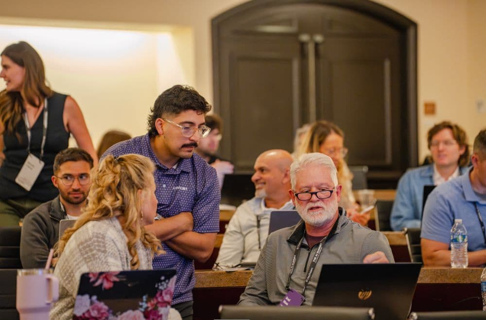 Attendees collaborating in the Let's Build session room