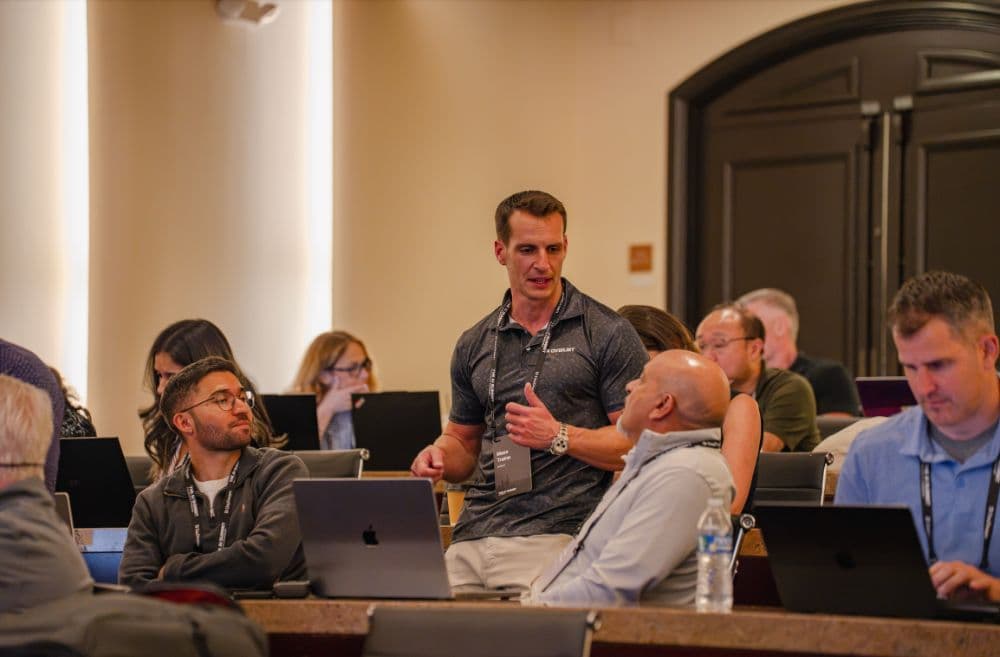 Overjet team member talking with attendees during Let's Build, Part 2