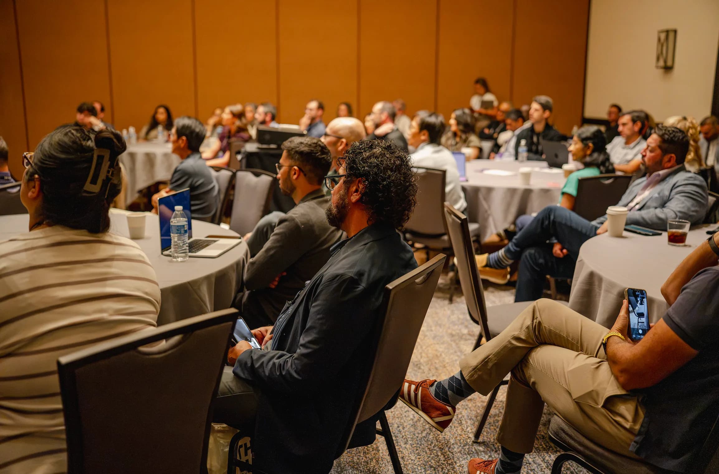 Attendees watching a lightning talk